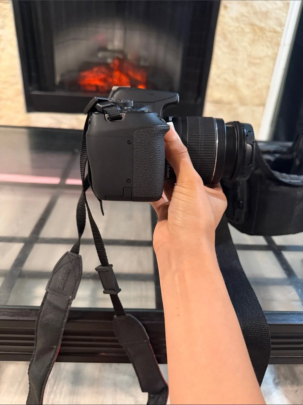 Canon Black DSLR Camera with Black Lens and Red-Trim Strap